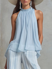Stylish outfit featuring a sleeveless top and wide-leg striped pants